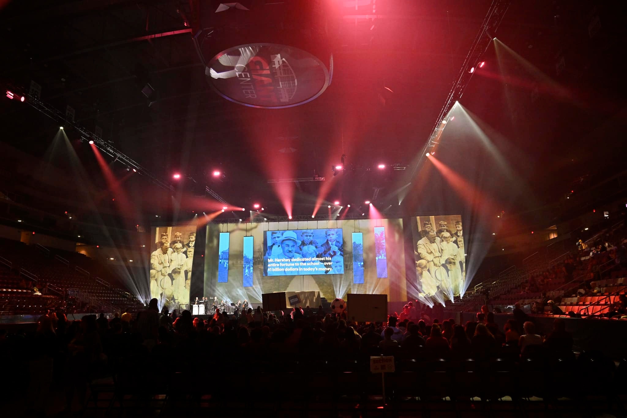 Arena-wide view of the Milton Hershey School kickoff stage, video, and lighting production